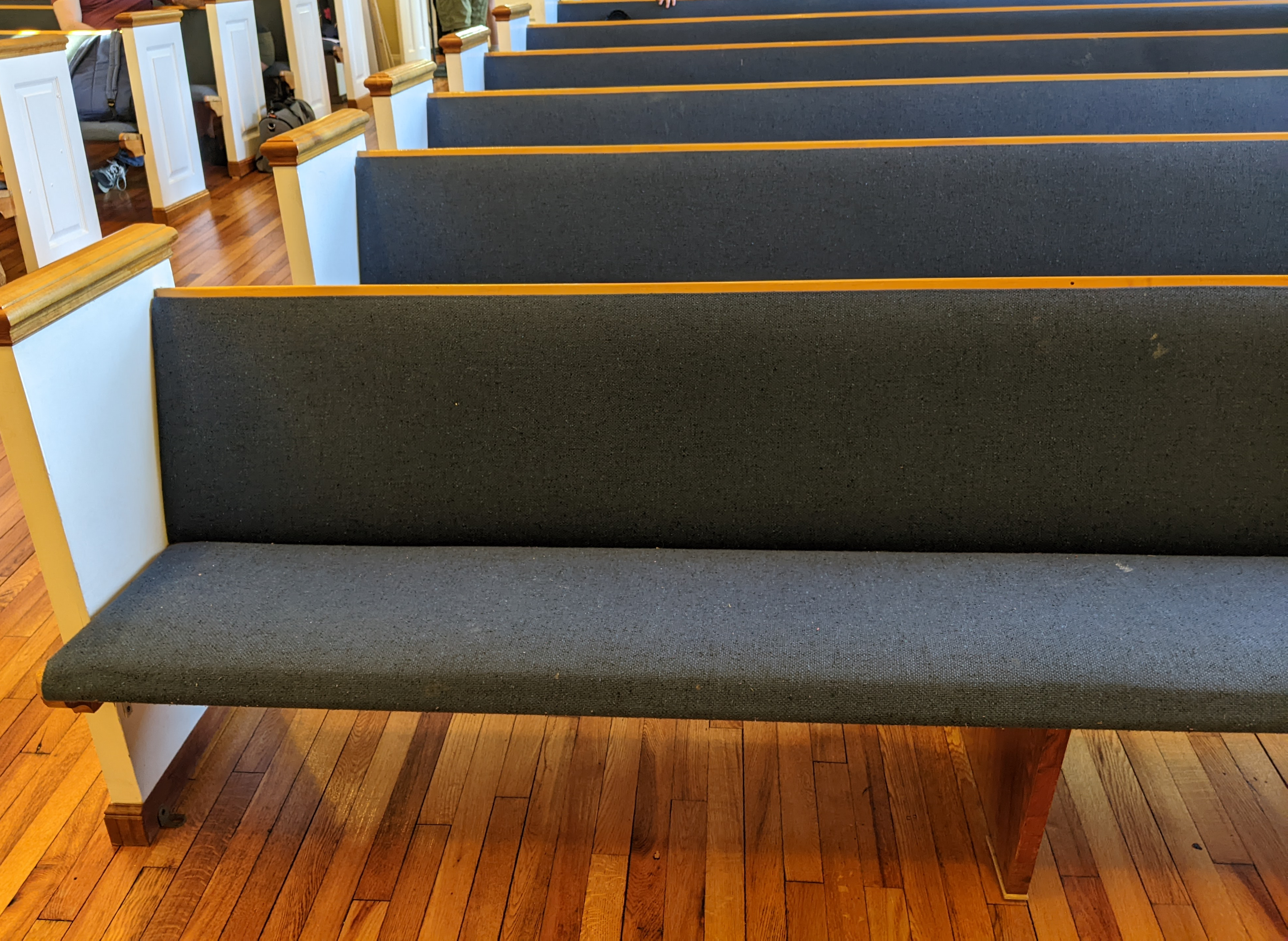 A close-up photo of the church seating.